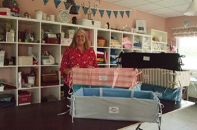Darcey with homemade cribs for new moms